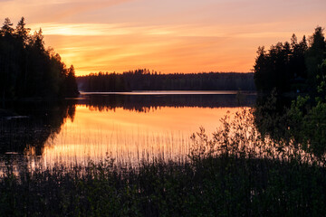 Sunset over lake with reflection in Tampere, Finland