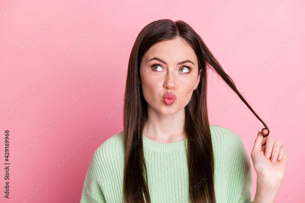 Wall mural Photo of nice person arm touch hair kiss lips look empty space wear sweater isolated on pink color background