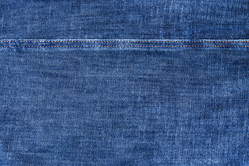 Blue jeans texture and seam closeup, thread stitch line, jean textile background, dark blue denim...