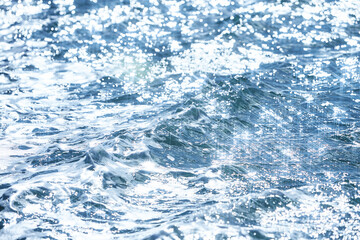 Detail of a sunlight reflecting in glittering sea. sparkler in water - background. sea water with...