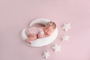 Fototapeta na wymiar Adorable newborn baby is sleeping on his belly Beginning of life and happy childhood concept