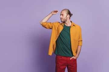 Close up portrait of curious guy with beard hand forehead look empty space