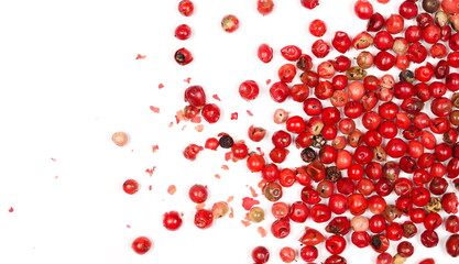 Red peppercorn pile isolated on white background, top view