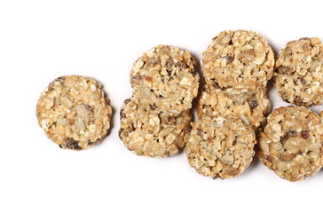 Muesli cookies, granola biscuits with peanuts, raisins and sunflower seeds isolated on white background, top view