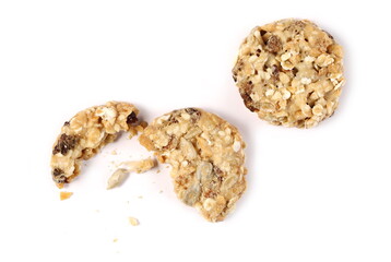 Muesli cookies, granola biscuits with peanuts, raisins and sunflower seeds isolated on white background, top view