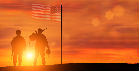 Military man and military woman on USA flag background. American national holidays concept