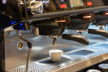 Espresso machine making coffee in cafeteria