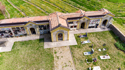 Christian cemetery in the countryside hills Italy