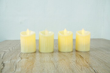 LED Candle Light electronic with space copy on wooden background