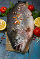 Large, fresh trout and vegetables