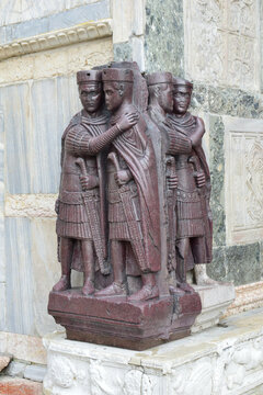 Portrait of the Four Tetrarchs at a corner of the façade of St Mark's Basilica in Venice, Italy. It is an ancient porphyry sculpture group of four Roman emperors from around 300 AD. 