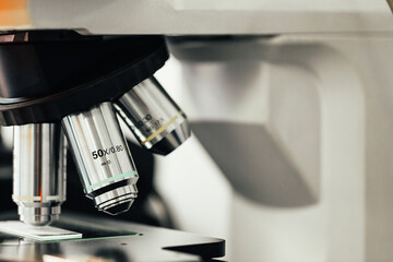 microscope with magnifying lenses in the chemical laboratory