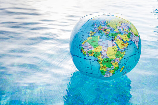 Plastic, inflatable globe floating in a swimming pool
