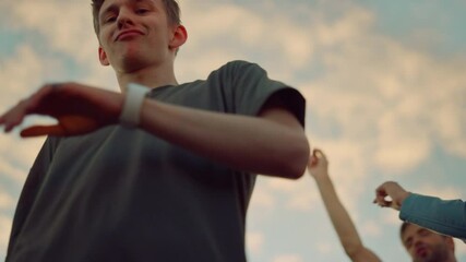 Young man burning up dance floor at disco. Dancer fooling around at party.