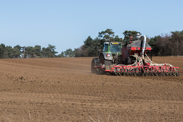 Fototapeta premium In the midst of the global corona pandemic, farmers worldwide are still working hard growing next years crop and ensuring the food supply lines can continue