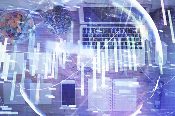 Business theme hologram drawings over computer on the desktop background. Top view. Multi exposure. Concept of international connections.