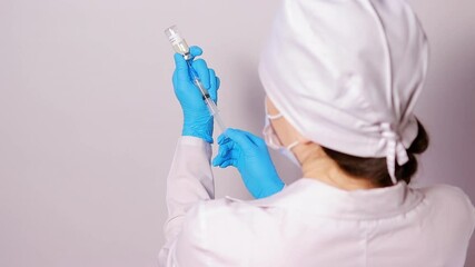A doctor or lab technician holds a rabies vaccine. Animal vaccination in veterinary medicine and rabies prevention in humans