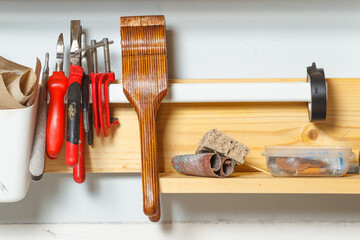 Tools in the workshop. Pliers, pliers, clamps, sandpaper. Concept of manual labor, home workshop