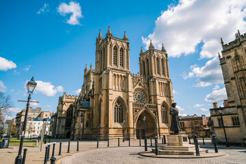 Gothic architecture of 12th Century Bristol Cathedral with cloudy blue sky, Bristol, England - obrazy, fototapety, plakaty