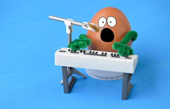 An egg singing and playing the piano.
