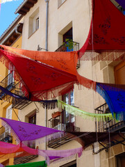 Festive traditional shawls on the street of La Latina district, Madrid, Spain