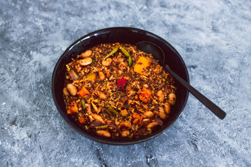 vegan quinoa risotto with sweet potatoes capsicum and green beans in spicy tomato sauce, healthy plant-based food