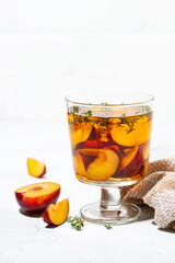 black tea with plum and thyme, vertical
