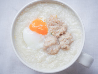 Top view of Rice porridge with minced pork and soft-boiled egg
