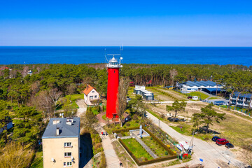 Red Lighthouse in the Krynica Morska town on the Vistula Spit. Poland - obrazy, fototapety, plakaty