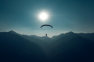 paragliding in the mountains - 429193591