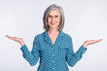 Photo of happy positive smiling beautiful businesswoman hold hands in balance promotion isolated on grey color background