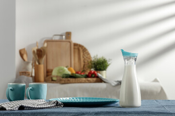 Fresh milk on the kitchen table in a beautiful morning and spring sunshine 