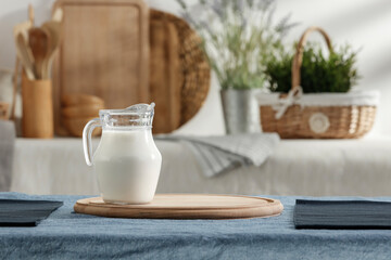 Fresh milk on the kitchen table in a beautiful morning and spring sunshine 
