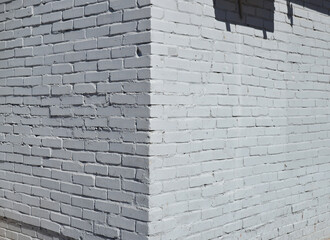 Brick wall painted with white paint.