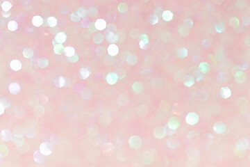 Shiny blurred pink background with bokeh for a festive mood. Greeting card template for entertainment.