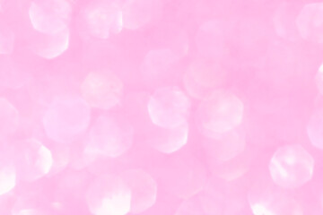 Shiny blurred pink background with bokeh for a festive mood. Greeting card template for entertainment.