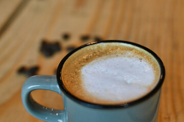 coffee, full breakfast and coffee beans on the table. freshly brewed coffee in an iron cup.