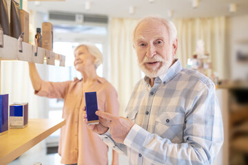 Elderly couple in a beauty shop looking excited