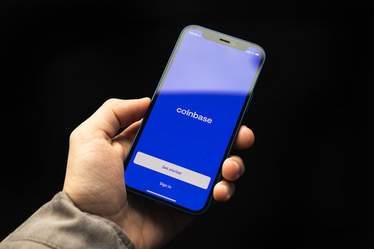 Kharkov, Ukraine - April 20, 2021: Coinbase cryptocurrency app titlce screen on Apple iPhone screen close-up