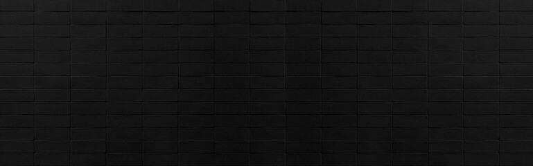 Panorama of Vintage black stone brick tile wall pattern and background seamless
