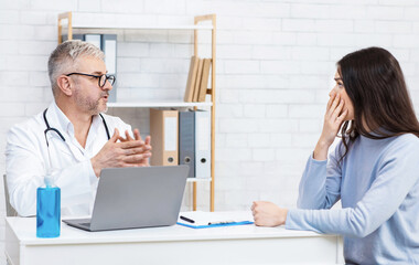 Consultation with family doctor therapist in modern clinic