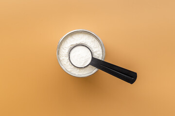 Sport nutrition - whey protein powder in scoop and jar