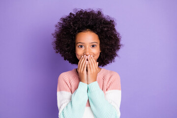 Portrait of optimistic nice girl close lips wear pink sweater isolated on violet color background