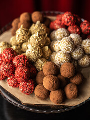 Chocolate Candies and Handmade Truffles Pistachios, hazelnuts, dried fruits, coconut, chocolate. Fitness sweets. Useful candy.