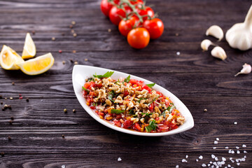 Assorted Middle Eastern and arabic dishes on a dark rustic background. Hummus, tabbouleh, pita, meat kebab, falafel, baklava. Halal food. Top view. Turkish foods, Turkish pizza, Turkish breakfast
