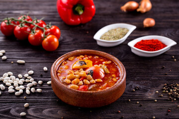 Assorted Middle Eastern and arabic dishes on a dark rustic background. Hummus, tabbouleh, pita, meat kebab, falafel, baklava. Halal food. Top view. Turkish foods, Turkish pizza, Turkish breakfast