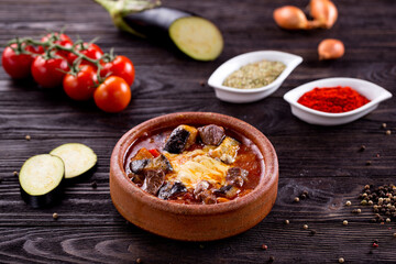 Assorted Middle Eastern and arabic dishes on a dark rustic background. Hummus, tabbouleh, pita, meat kebab, falafel, baklava. Halal food. Top view. Turkish foods, Turkish pizza, Turkish breakfast