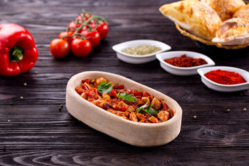 Assorted Middle Eastern and arabic dishes on a dark rustic background. Hummus, tabbouleh, pita, meat kebab, falafel, baklava. Halal food. Top view. Turkish foods, Turkish pizza, Turkish breakfast