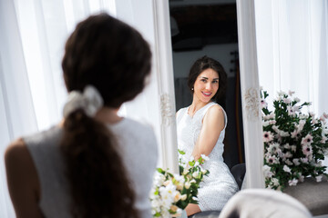 close up portrait happy smiling girl watching herself in a mirror