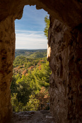 Provence landscape seen through a hole in a rock in Provence, France during summer